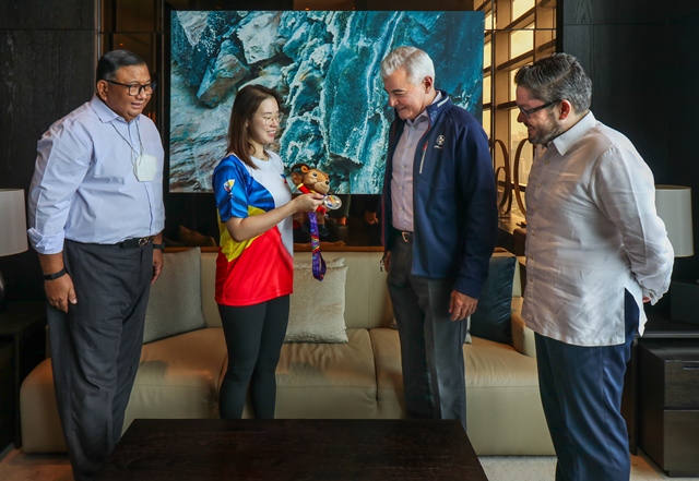 SEAGames Silver Medalist and BPI Unibanker Alexis Sy presents her medal and iconic Saola stuffed toy